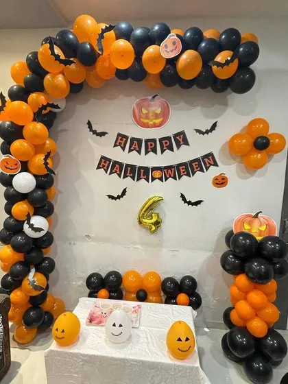 Our fun Halloween party setup, designed with a striking orange and black balloon arch. We included a 'Happy Halloween' banner, bat cutouts, and friendly pumpkin characters to create a festive and cheerful atmosphere for all ages.