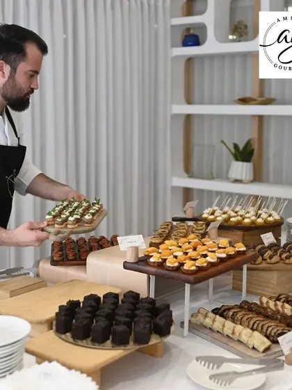 Here I am, arranging a beautiful spread for an event. Our catering service brings the best of modern French cuisine to your table, from intimate gatherings to large corporate functions.