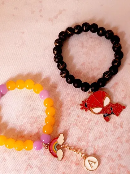 A perfect pair for the perfect siblings. Here I created a custom Spider-Man beaded bracelet for the brother and a personalized rainbow initial bracelet for the sister.