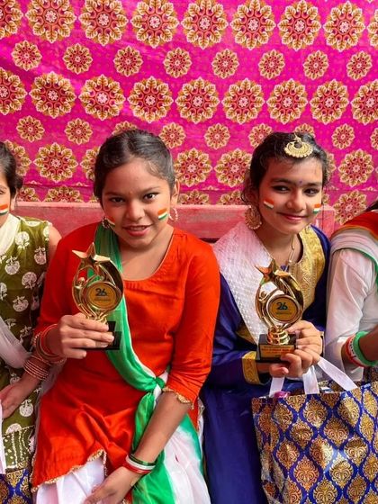 A close-up of our winners, proudly displaying their trophies. These achievements are a testament to their talent and the training they receive at our camp.