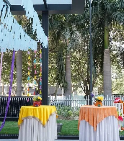 Even functional elements can be part of the theme. I used brightly colored tablecloths for the cocktail tables at this outdoor Holi event, tying them into the overall vibrant color scheme and ensuring every detail was picture perfect.