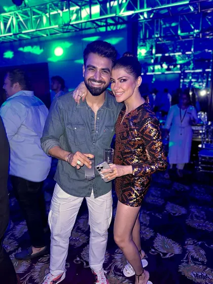 Posing with a guest at an after-party. The fun continues long after the formal event is over, and I'm there to keep the vibe going.