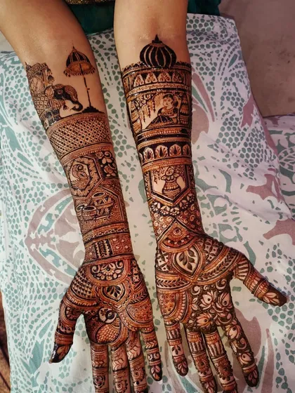 Your story, told in henna. This custom bridal design features a traditional doli (palanquin) scene, majestic elephants, and sacred kalash motifs, making the mehndi truly personal and unique to the bride's journey.