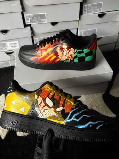 A full view of the Demon Slayer custom sneakers, with Tanjiro's water breathing and Zenitsu's lightning effects.