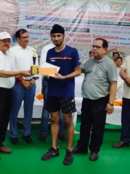 **Honoring a State Champion.** Ishmeet receiving his award for winning the U-17 Boys' Singles gold medal at the U.P. State tournament.