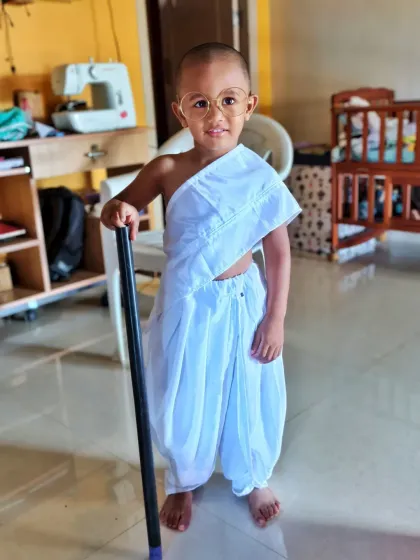 Look at this cute little Gandhiji, all ready for his school event. I provide the complete Mahatma Gandhi fancy dress costume, including the dhoti, shawl, glasses, and stick, so your child can look the part perfectly.
