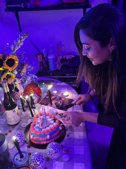 The birthday girl cutting her unique, heart-shaped custom cake. I love creating designs that match the energy and vibe of the celebration.