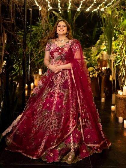 A timeless and classic Roka look. Set against a dreamy, candlelit backdrop, her makeup is soft and romantic, with rosy tones that enhance her natural bridal glow.