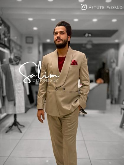 A client in a beige double-breasted suit, paired with a red t-shirt for a modern, smart-casual look. This shows the versatility of my tailored pieces.