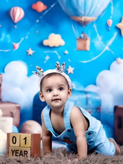 This little boy is exploring the set during his first birthday teddy bear photoshoot.