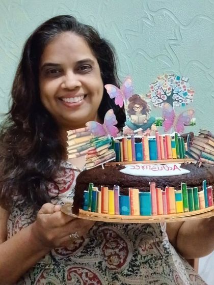 Here I am with the book-themed cake. I really enjoyed creating this design.
