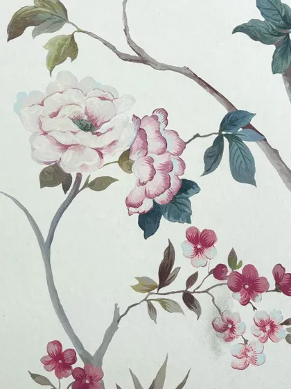 A detailed view of the painterly quality of our floral Chinoiserie designs. The soft blending of pinks and greens captures the beauty of a peony in bloom, turning the wall into a work of art.
