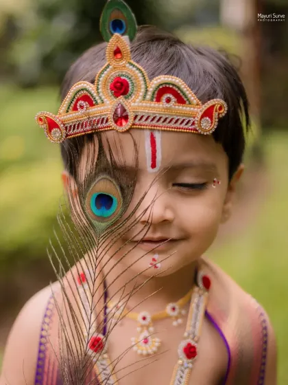 This artistic portrait from a Little Krishna themed shoot is one of my favorites. The way the peacock feather gently covers his eye creates a sense of innocence and divinity, making it a truly special memory for his family.