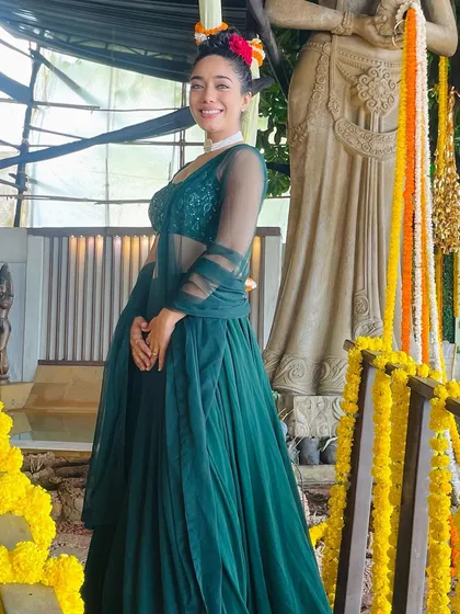 The journey should be more beautiful than the destination. A happy, smiling picture in a lovely green lehenga.