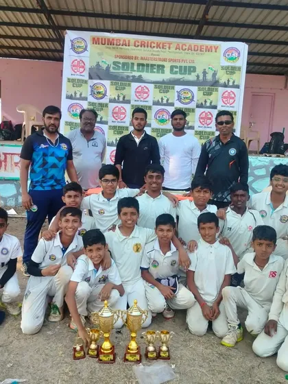The Mumbai Cricket Academy team posing with the Soldier Cup 2024 trophy. We won the series by winning two out of the three matches, showing great consistency.