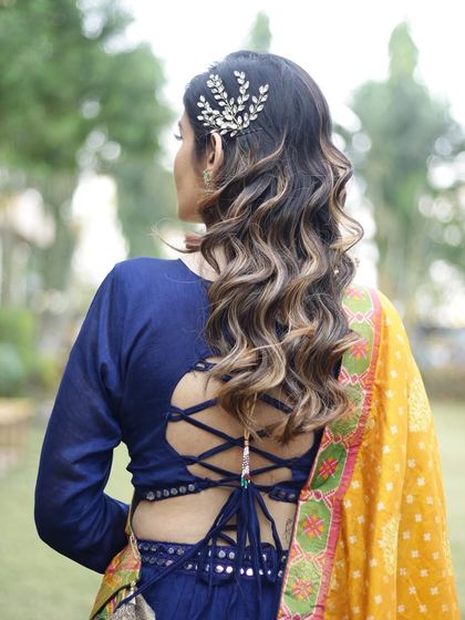 A back view of the gorgeous Hollywood waves and the elegant hair accessory. We love creating hairstyles that look beautiful from every angle.
