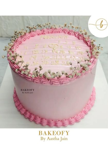 For my beloved customers who seek simplicity. This pretty pink Lotus Biscoff cake is decorated with a simple border and delicate baby's breath flowers.