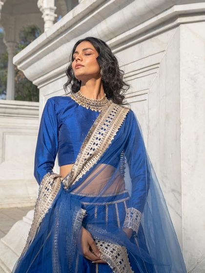 Inspired by the costumes of Heeramandi, this royal blue silk lehenga is simply gorgeous. Rent or buy this high-quality piece.