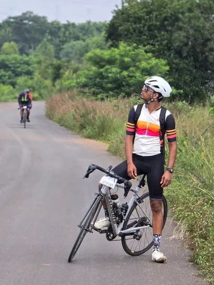 A rider posing with his bike on a scenic, rural road during the Rajyotsava 200k brevet. These rides take us through some beautiful parts of our state.