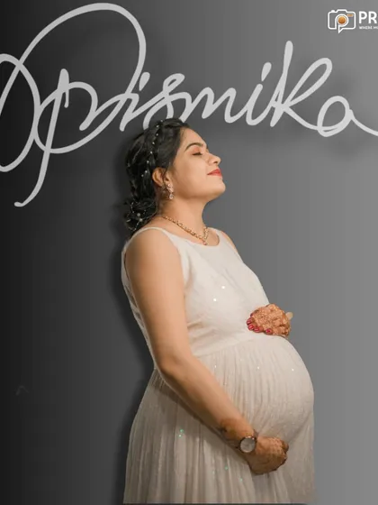 Sometimes, simplicity is the most powerful. This serene solo portrait captures the quiet confidence and beautiful glow of motherhood in our comfortable studio, using soft lighting to highlight the pure joy of this special time.