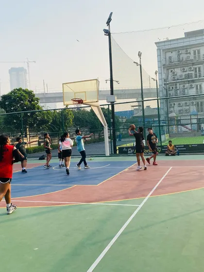 A female player takes a shot during a mixed-gender game.