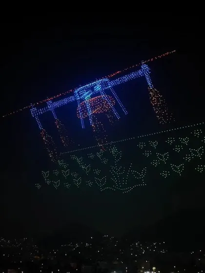 A complex formation of a large drone carrying butterflies, another one of our record-breaking designs. This showcases our ability to create intricate and meaningful aerial images.