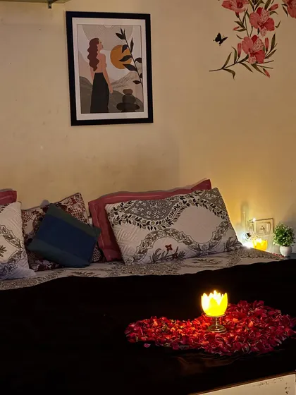 I add romantic touches like a heart made of rose petals and a candle on the bed to make you feel special.