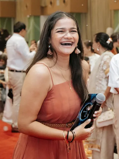 A candid laugh captured during a baby name reveal party. These genuine moments of joy are what make hosting family events so special.