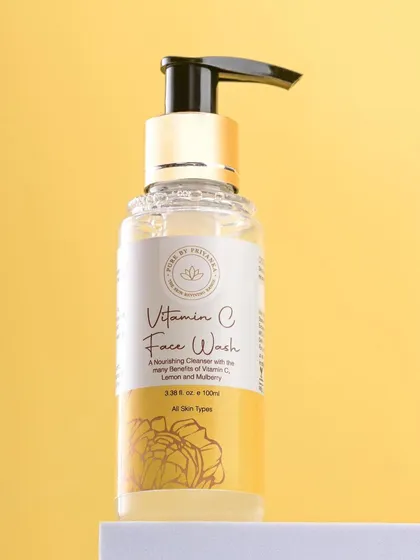 A bright, clean shot of Pure by Priyanka's Vitamin C Face Wash against a solid yellow background. This vibrant presentation is perfect for a product highlighting vitamin C.