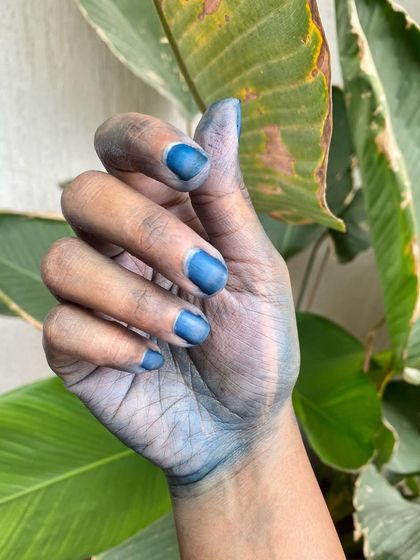 My hands, stained with natural indigo dye. For me, creating with my hands is essential. It is how I connect with the materials and pour my heart into my work, ensuring every workshop and product is authentic and full of love.