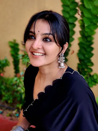 A candid moment with the gorgeous Manju Warrier. For this look, I aimed for an elegant and understated style, using soft tones and a simple hairstyle to highlight her natural beauty and create a timeless portrait.