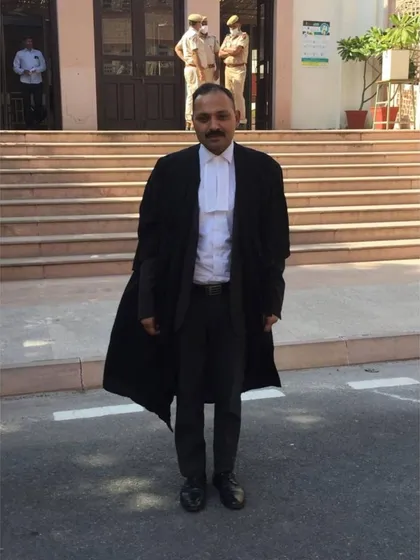 Standing outside the Jaipur High Court. My work takes me to different parts of the country, handling a variety of legal matters.