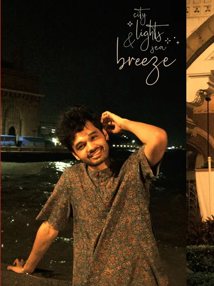 A happy moment by the sea at night, with the city lights and sea breeze as the perfect companions.