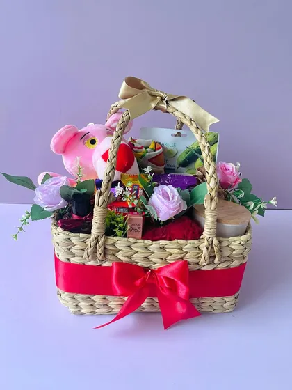 This Kauna basket hamper is customized for a birthday with a Pink Panther plush toy and other fun treats. I can customize these baskets for any occasion.