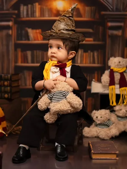 We bring magical worlds to life, like this Harry Potter themed toddler shoot. Our studio is equipped with detailed backdrops, costumes like the sorting hat and scarf, and props to create an authentic and enchanting experience for your little wizard.