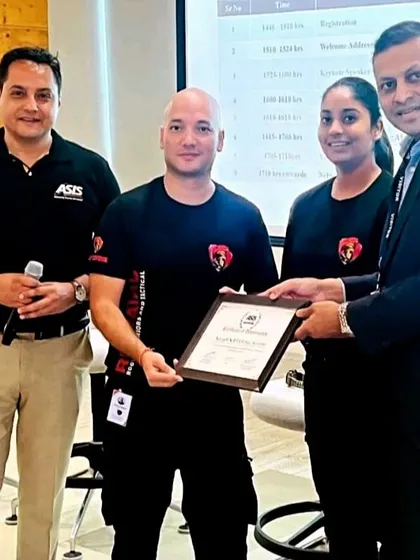 Receiving a certificate of appreciation from ASIS International for our partnership in training underprivileged girls.