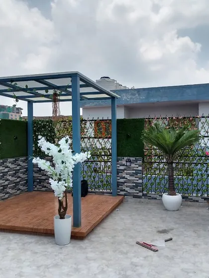 A complete terrace makeover I did in Paschim Vihar, West Delhi. I used a combination of artificial green wall panels and turf to define this beautiful outdoor seating area with a pergola.