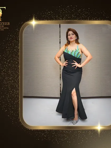 Here I am in a black gown with a thigh-high slit and a beautifully embellished bodice. This dress is designed to make you feel confident and glamorous at any party or special event.