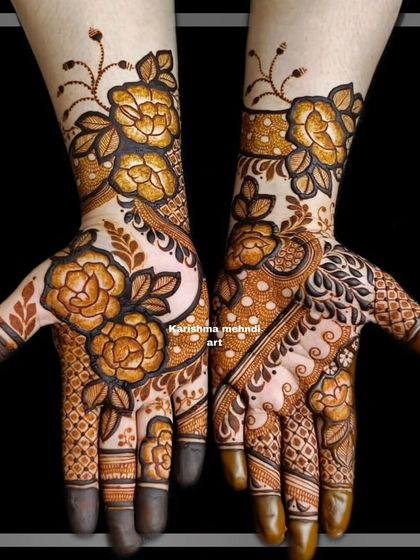 A close-up of the modern floral design from the previous video. The image clearly shows the contrast between the bold flowers and the delicate, airy patterns on the palm.