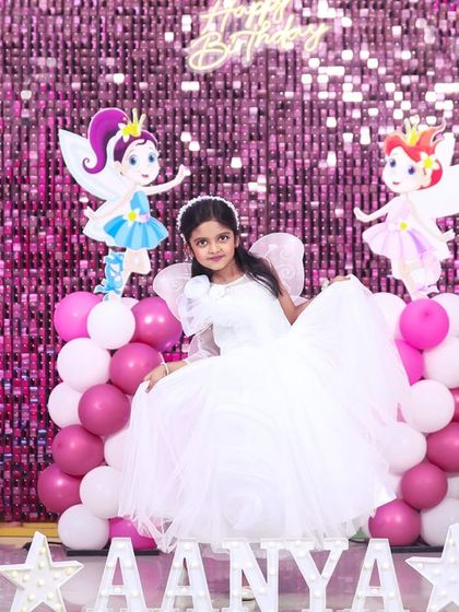 A playful 'Minions' themed birthday party, with yellow and blue decor, character cutouts, and fun props, creating a mischievous and joyful atmosphere.