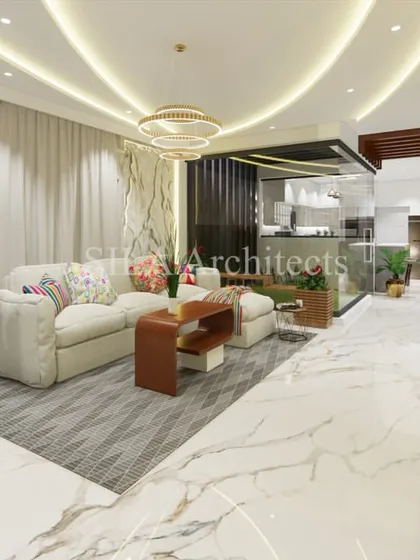A complete view of the luxurious living space, showing how we use different textures, lighting, and furniture to define areas within an open-concept floor plan while maintaining a harmonious flow.