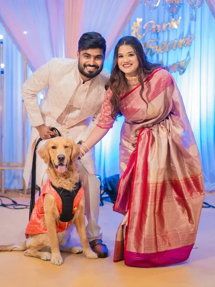 Including pets in your celebration makes it even more special. Prachi and Sandeep's adorable dog joins them for a family portrait at their engagement.