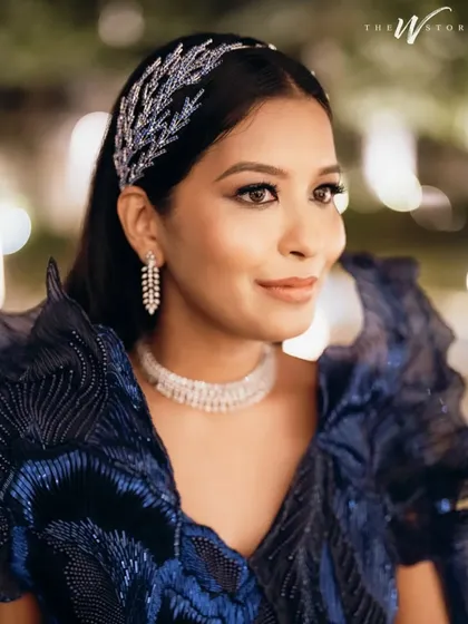 For a cocktail or sangeet night, we can dial up the drama. This look features sultry, smoky eyes with a touch of shimmer, balanced with glowing skin and a neutral lip. It’s a classic after-dark look, designed to be captivating and last through a night of celebration.