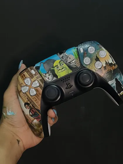 This custom PS5 controller is a mashup of fandoms: 'The Last of Us', 'Shrek' (featuring the client's cat!), and 'Harry Potter'. It was a challenge to fit it all, but I love how it tells a story.