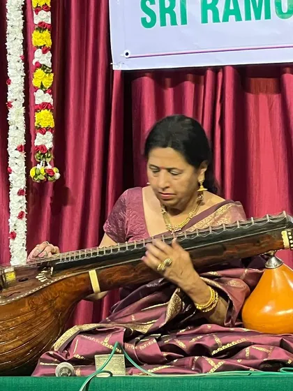 A close-up of me, completely absorbed in the music. This is my world, where every note from the veena tells a story.