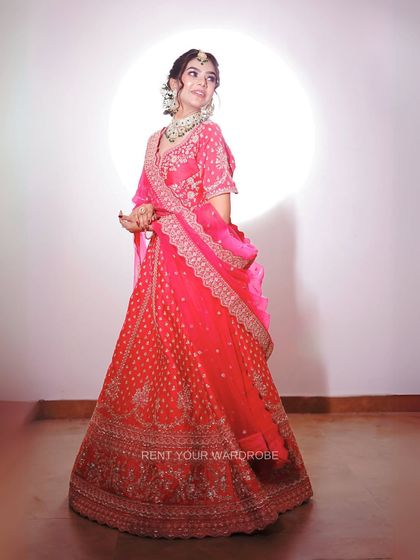 A full-length portrait in our bright pink lehenga. The outfit’s color and design are perfect for creating eye-catching bridal content.