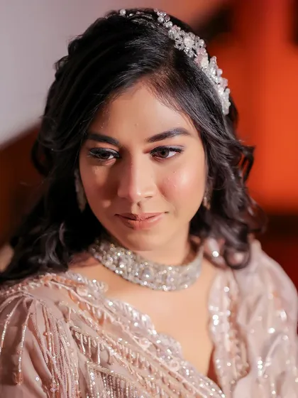 A delicate and beautiful portrait of the bride-to-be during her Roka ceremony. Her soft expression and elegant accessories capture the grace of this traditional first step.