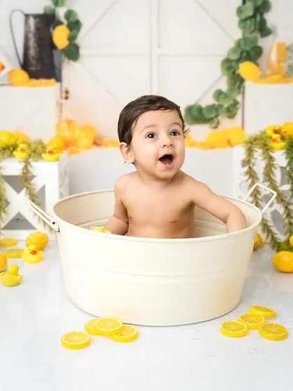 The look of pure surprise and happiness! These splash sessions are a wonderful addition to a first birthday photoshoot.