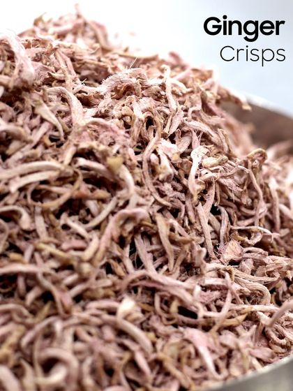 A close-up of my handmade Ginger Crisps. Made from young, seasonal ginger, these crisps are light, healthy, and have a clean texture that makes them incredibly crispy and flavourful.