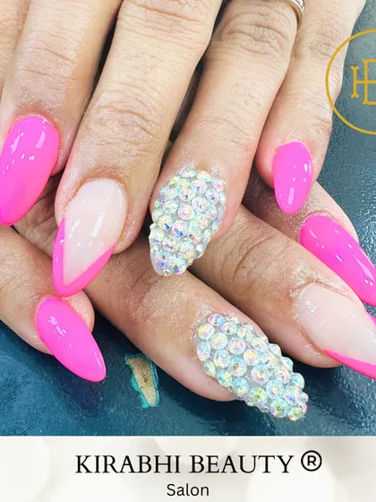 Go big or go home with this glamorous set. I combined a vibrant hot pink gel polish with fully studded rhinestone accent nails for a look that is all about sparkle and fun.